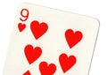Close up of a nine of hearts playing card.