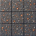 Close up on nine square tiles. Each tile shows various small stones or rocks set in concrete. This creates textured surface. Royalty Free Stock Photo