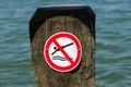 Close up of a No Diving sign on a wooden pile Royalty Free Stock Photo