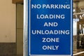 Close up of no parking, loading zone signage