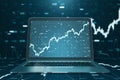 Close up of notebook computer with creative forex chart. Trade, finance, technology and communication concept.