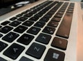 Close-up on the notebook keyboard from a different tilted angle, highlighting work from home, technology close to everyday life,