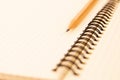 Close-up notebook or note book diary with a pencil on wooden desk Royalty Free Stock Photo