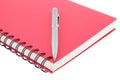 Close up notebook spiral bound and pen on white background Royalty Free Stock Photo