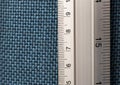 Close-up Numeric focus Ruler on blue fabricboard