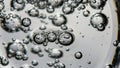 Numerous air bubbles suspended in a clear liquid creating an abstract Royalty Free Stock Photo