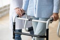 Close up nurse holding disabled older woman hand on walker Royalty Free Stock Photo