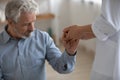 Close up nurse caregiver holding lonely mature patient hand Royalty Free Stock Photo