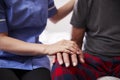 Close Up Of Nurse Comforting Senior Man On Home Visit Royalty Free Stock Photo