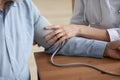 Close up of nurse measure blood pressure of elderly patient Royalty Free Stock Photo