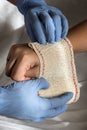 Close-up Of A Nurse Tying Bandage On Patient`s Foot Royalty Free Stock Photo