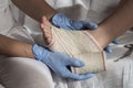 Close-up Of A Nurse Tying Bandage On Patient`s Foot Royalty Free Stock Photo