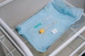 Close-up of nurse wearing medical gloves takes syringe for drawing blood.