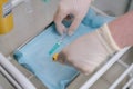 Close-up of nurse wearing medical gloves takes syringe for drawing blood.