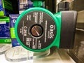 OASIS circulation pump displayed in a store, with its specifications and functions visible in the background Royalty Free Stock Photo