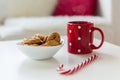 Close up of oat cookies, sugar cane candy and cup Royalty Free Stock Photo