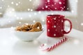 Close up of oat cookies, sugar cane candy and cup Royalty Free Stock Photo