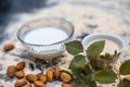 Close up of oats face pack or Avena sativa facial mask i.e crushed or powdered almonds or badam,milk and grounded oats on wooden.