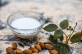 Close up of oats face pack or Avena sativa facial mask i.e crushed or powdered almonds or badam,milk and grounded oats on wooden