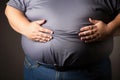 Close up of an obese mans overweight tummy. Unhealthy waistline