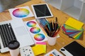 Close up object creative designs concept. Creative designs workplace with laptop, table, pencil color and color bar example on the