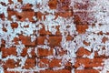 Old red brick wall with cracked paint Royalty Free Stock Photo