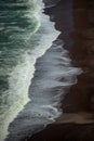 Close up of ocean surf on red sand beach Royalty Free Stock Photo