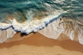 Close up of ocean waves rolling onto a beautiful beach with pink sand at sunrise. Sandy coastline with white turquiose sea waves.