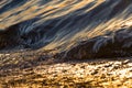 Close up ocean waves. Sea with golden waves early morning. Natural background.