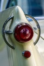 Close up of the odd looking tail light of a classic American car from the fifties