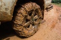 Close up of off road car tire with chain on it Royalty Free Stock Photo