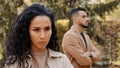 Close up offended upset disappointed girl woman wife girlfriend ignore angry guy man standing on blurred background Royalty Free Stock Photo