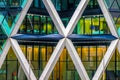 Close up of an office building with horizontal, diagonal and vertical playful lines.