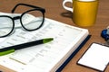 Close up office desk with open book information page Royalty Free Stock Photo