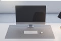 Close up of office table with empty computer monitor and rfeflections, lamp and keyboard on blurry background.