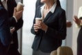 Close up of office workers chat drinking takeaway coffee Royalty Free Stock Photo