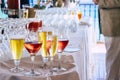 Close up og glasses with coloured fresh tasty drinks with alcohol and not on a table during catering party event - restaurant and