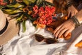 Close up oh woman hand with bohemian style accessories. picnic concept