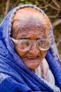 Close up of old aged poor lady bagging in front of mosque Royalty Free Stock Photo