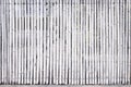 Old bamboo wood fence texture with seamless vertical patterns light white grey background and space Royalty Free Stock Photo