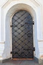 Close-up of old black iron arched door Royalty Free Stock Photo