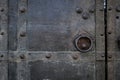 Close-up of an old black iron door with a handle Royalty Free Stock Photo
