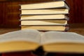 Close-up of an old book open on the library desk selective focus and shallow depth of field. Reading books Royalty Free Stock Photo