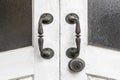 Old brass door handle and white wooden door Royalty Free Stock Photo