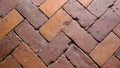 Close up of old brick paved yard, clay brick paving pattern for zigzag style, old paving brick floor is also called