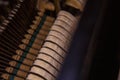 Close up of old broken dusty piano from the inside. Hammers in abandoned piano striking strings. Music playing from the ancient Royalty Free Stock Photo