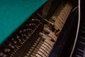 Close up of old broken dusty piano from the inside. Hammers in abandoned piano striking strings. Music playing from the ancient Royalty Free Stock Photo