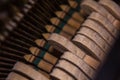 Close up of old broken dusty piano from the inside. Hammers in abandoned piano striking strings. Music playing from the ancient Royalty Free Stock Photo