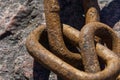 close up of an old brown rust chain
