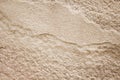 Old brown sandstone background in seamless wave shaped patterns nature texture Royalty Free Stock Photo